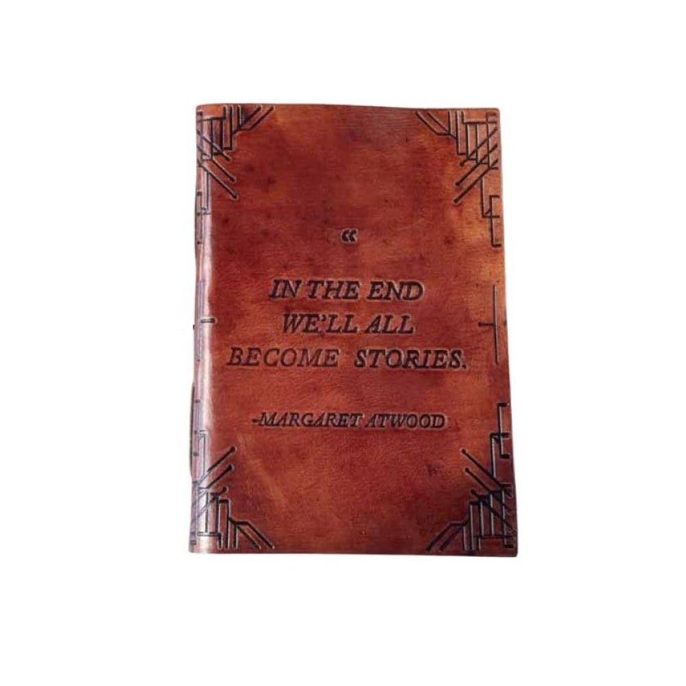 Red-brown leather journal cover with embossed corner pattern and Margaret Atwood quote