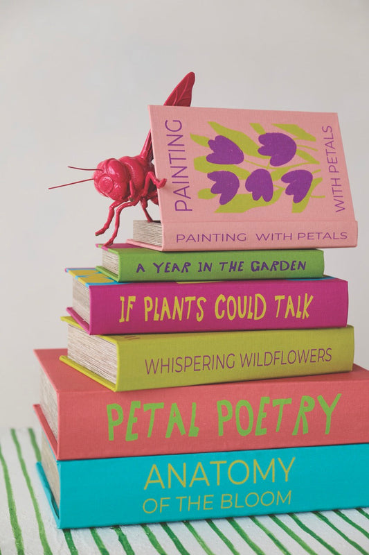 Stacked canvas storage book box with floral book spines and rose decoration