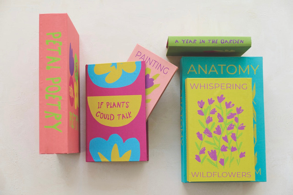 Colorful book-shaped canvas storage box with three upright books and spines