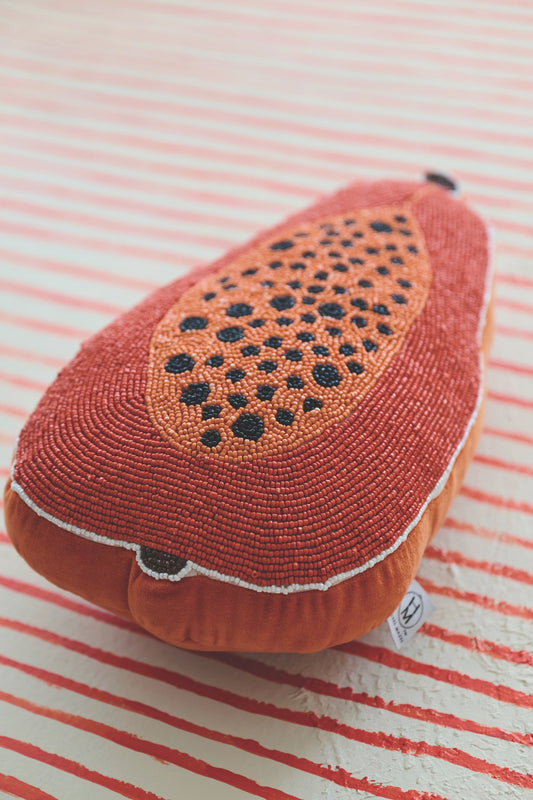 Papaya-shaped accent pillow front, orange beaded surface with black dot pattern