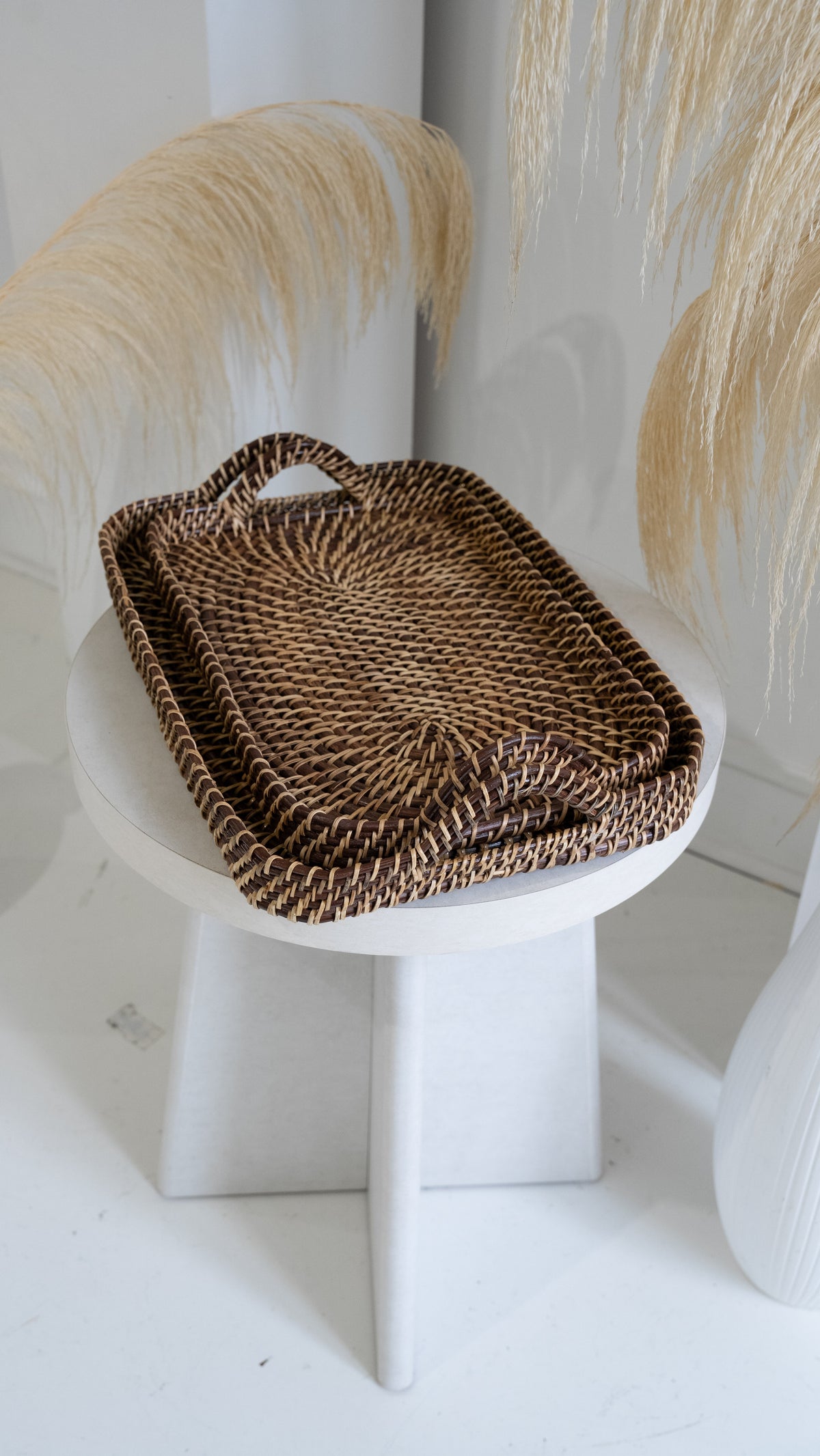 Woven rectangle tray with side handle, natural tan and dark brown pattern