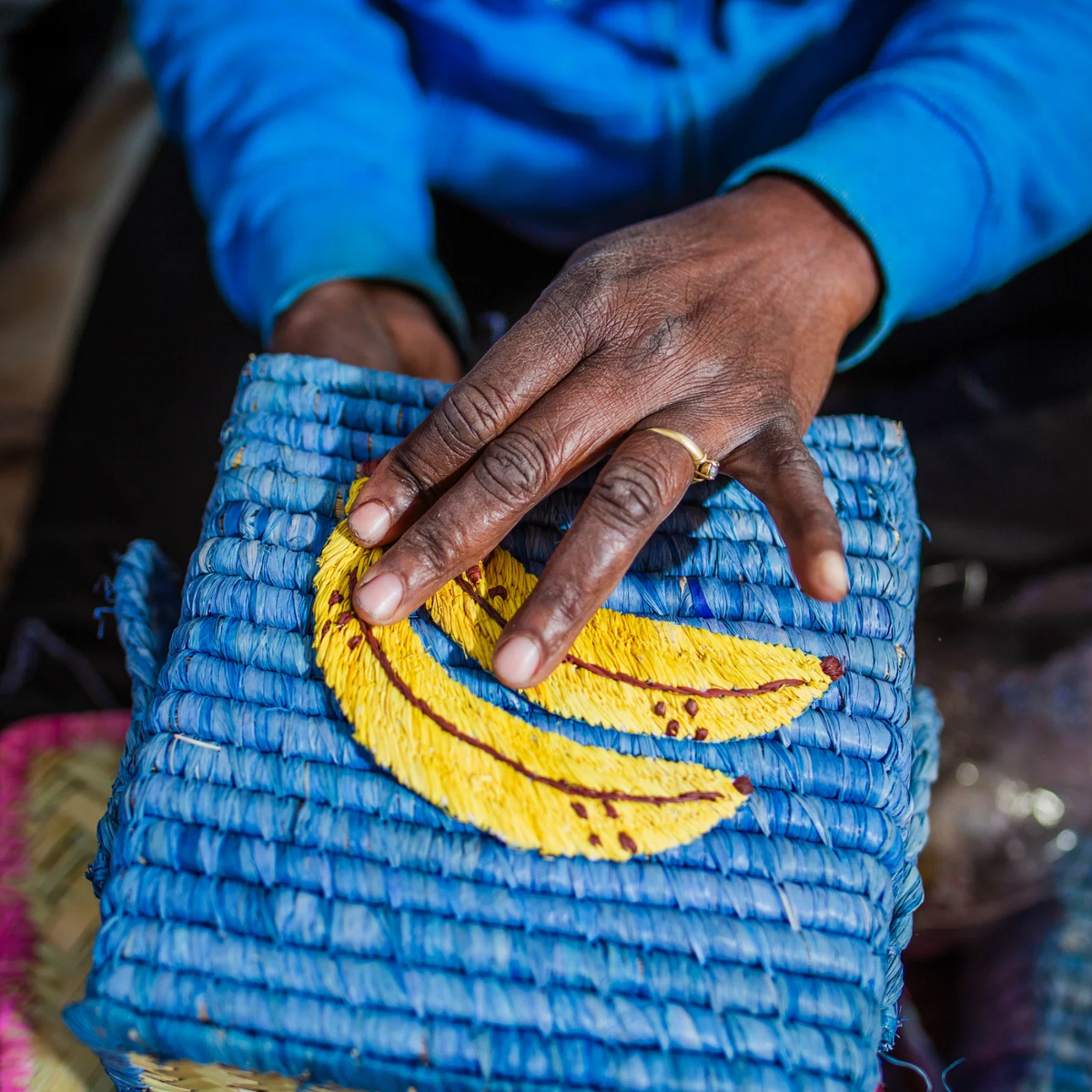 Blue square raffia basket with banana motif