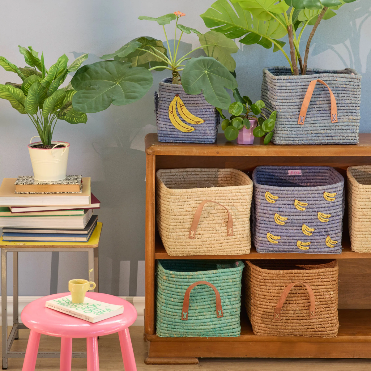Square blue raffia storage basket with yellow banana print and side handles