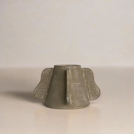 Small dark green ceramic vessel with ribbed sides and rounded flared rim