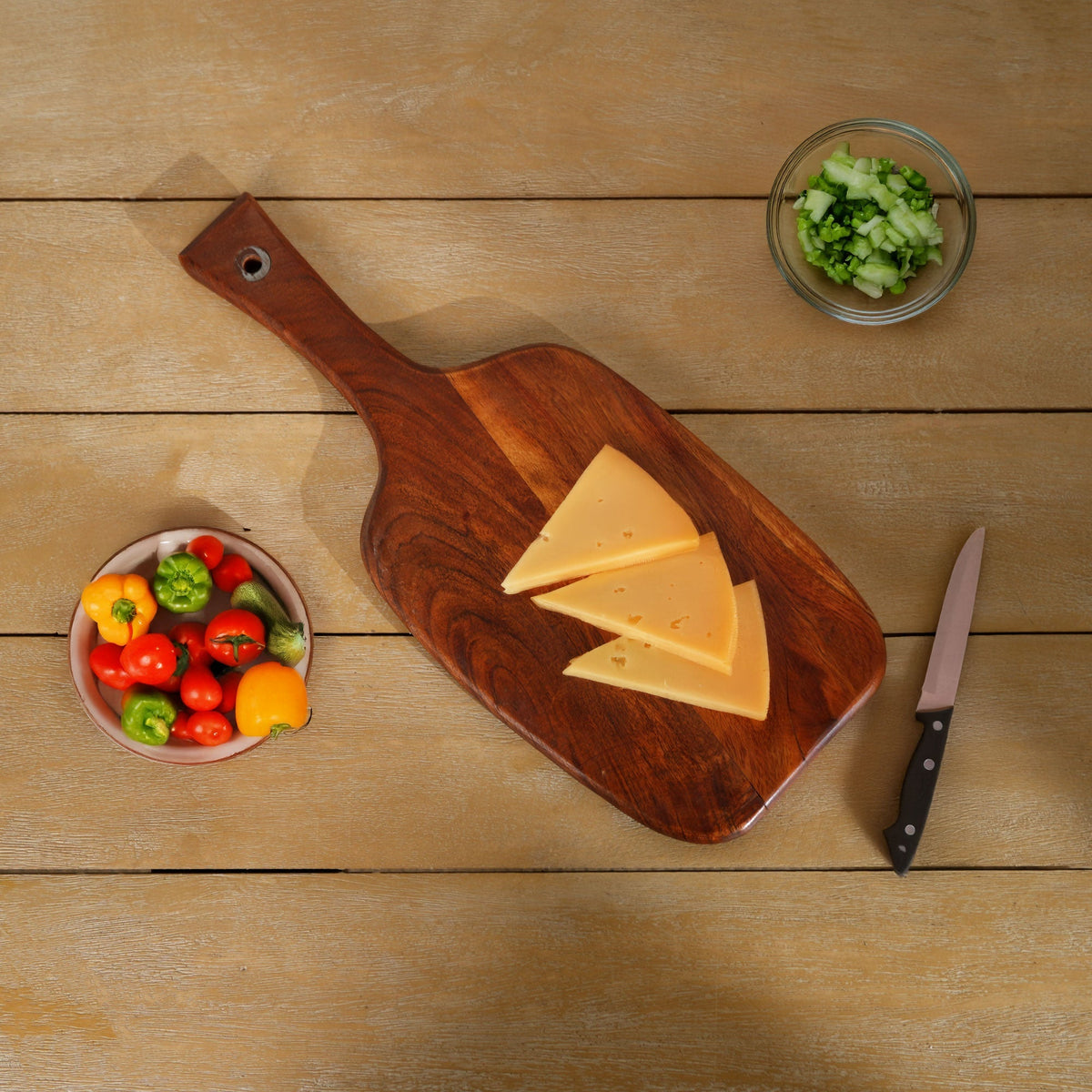 Wooden paddle cutting board with handle hole and leather cord, set of 3