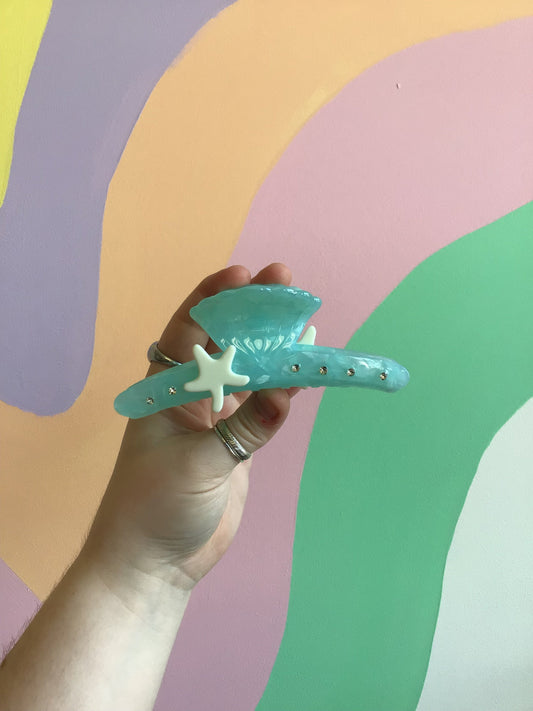 Blue Crush shell hair claw, teal blue with star cutout and curved teeth