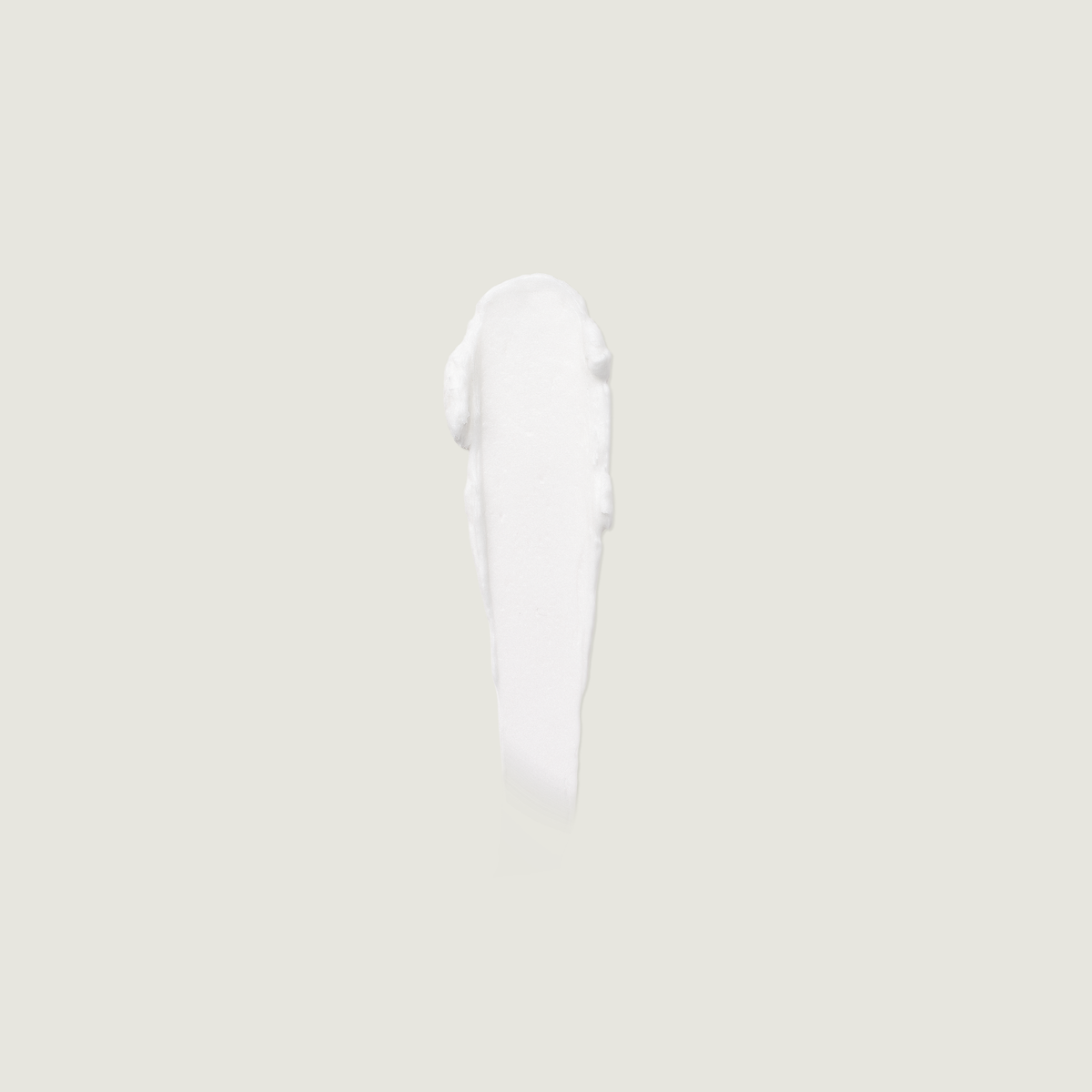 White whipped balm dollop on a small applicator