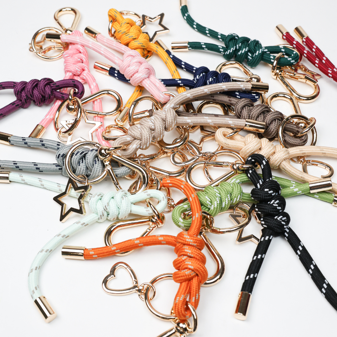 Colorful paracord key chains with gold-tone clasps and star charms