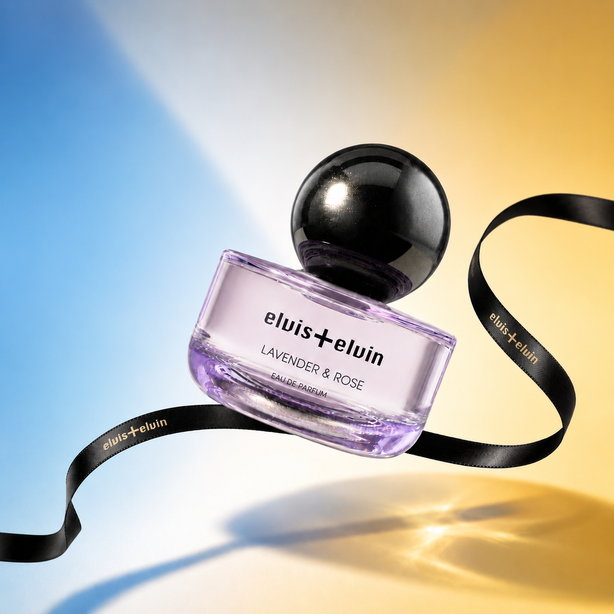 Lavender & Rose perfume bottle with black cap and purple glass, with black ribbon
