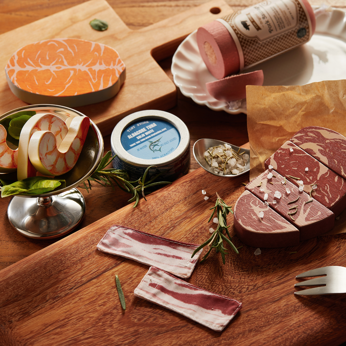 Organic meat and seafood toy set with sliced bacon, fish slices, and packaged meat rolls
