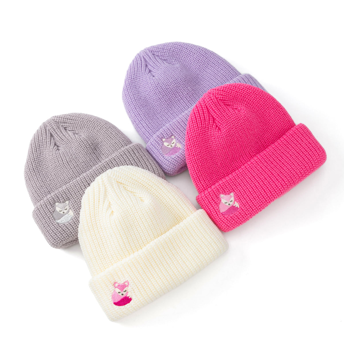 Four knitted fox beanies in lavender, gray, white, and bright pink