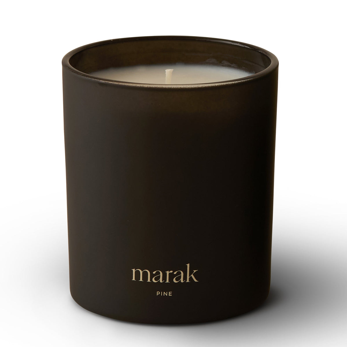 Dark scented candle jar with white wick and marak pine label