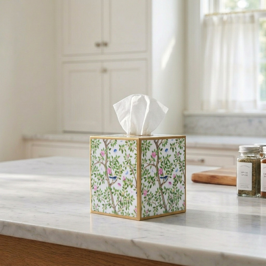 Enameled tissue box cover with garden floral pattern, white tissue opening, blue and pink accents