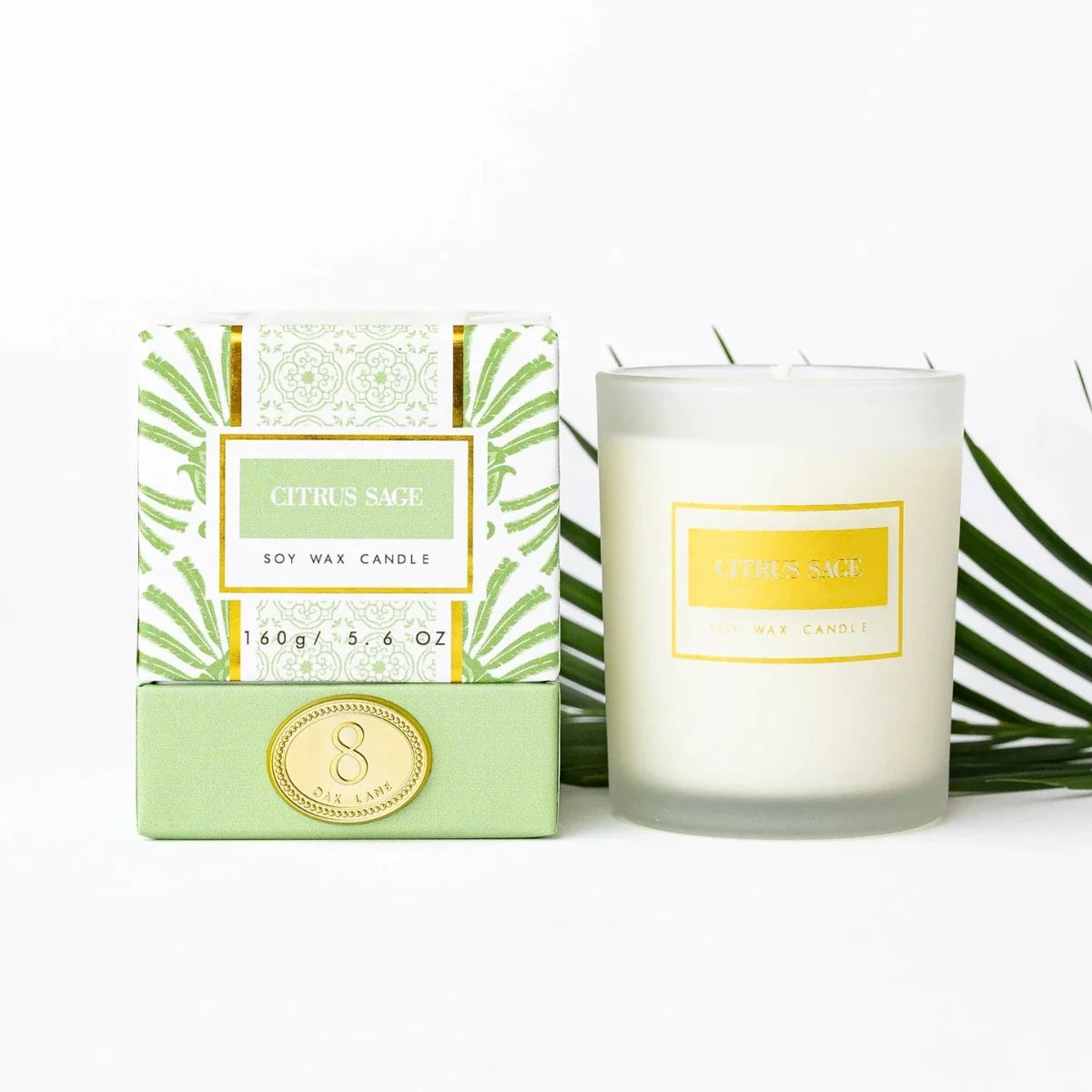 Boxed citrus sage soy wax candle with clear glass jar and gold label