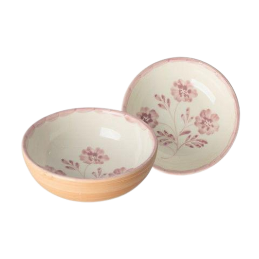 Round ceramic bowl with hand-painted pink flowers and orange outer rim