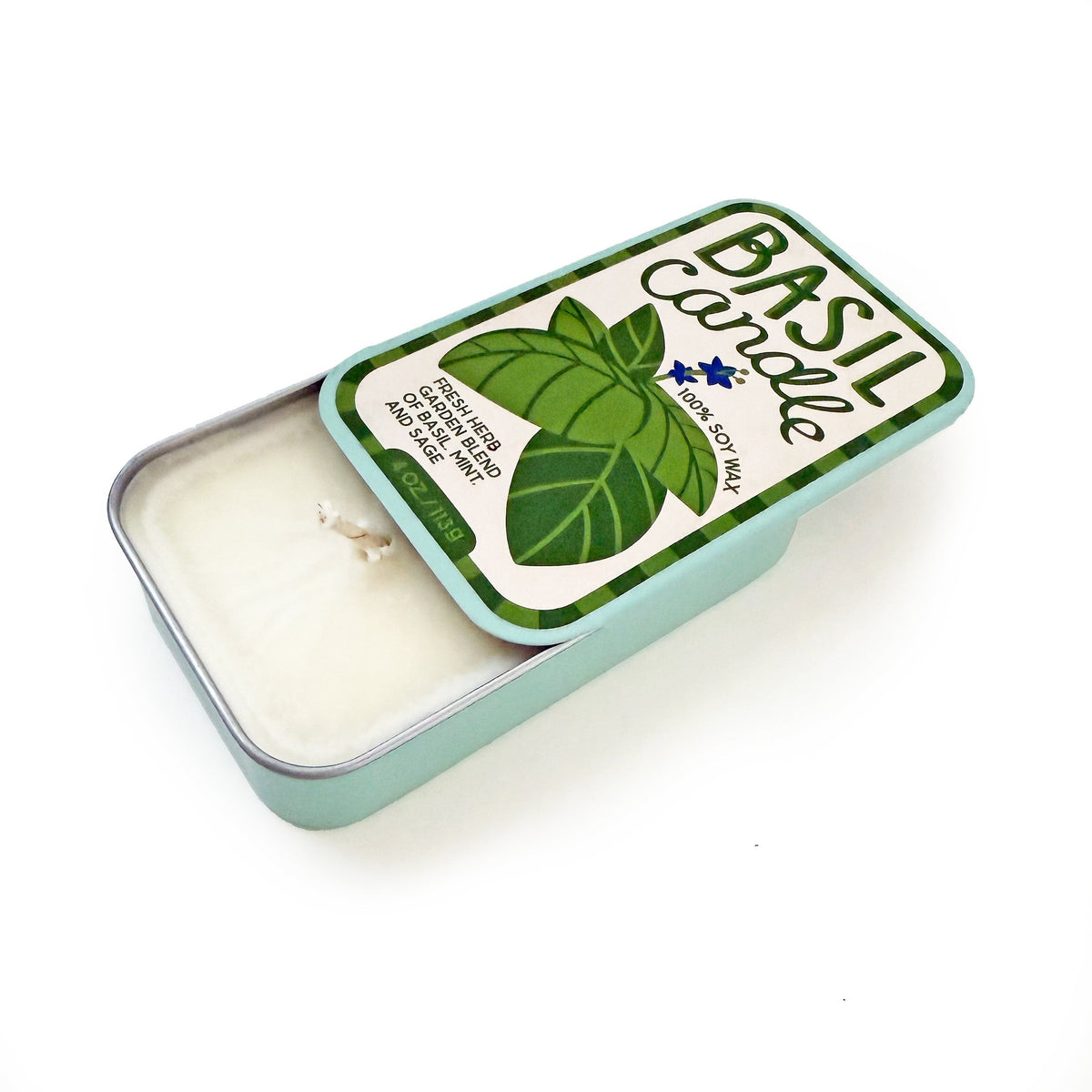 Basil-scent soy candle tin with white wax surface and metal container frame.