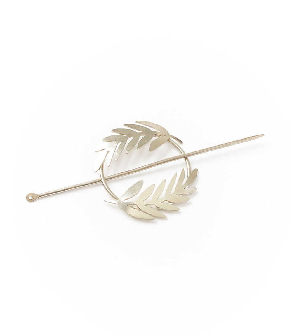 Silver fern hair slide with curved bar and stacked leaf details, silver-tone