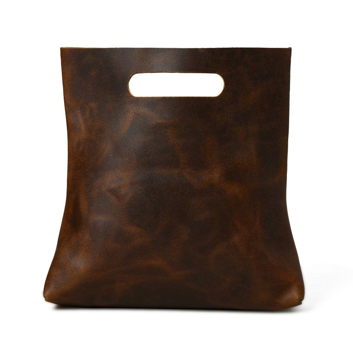 Brown leather handbag front view with top handle cutout and structured base