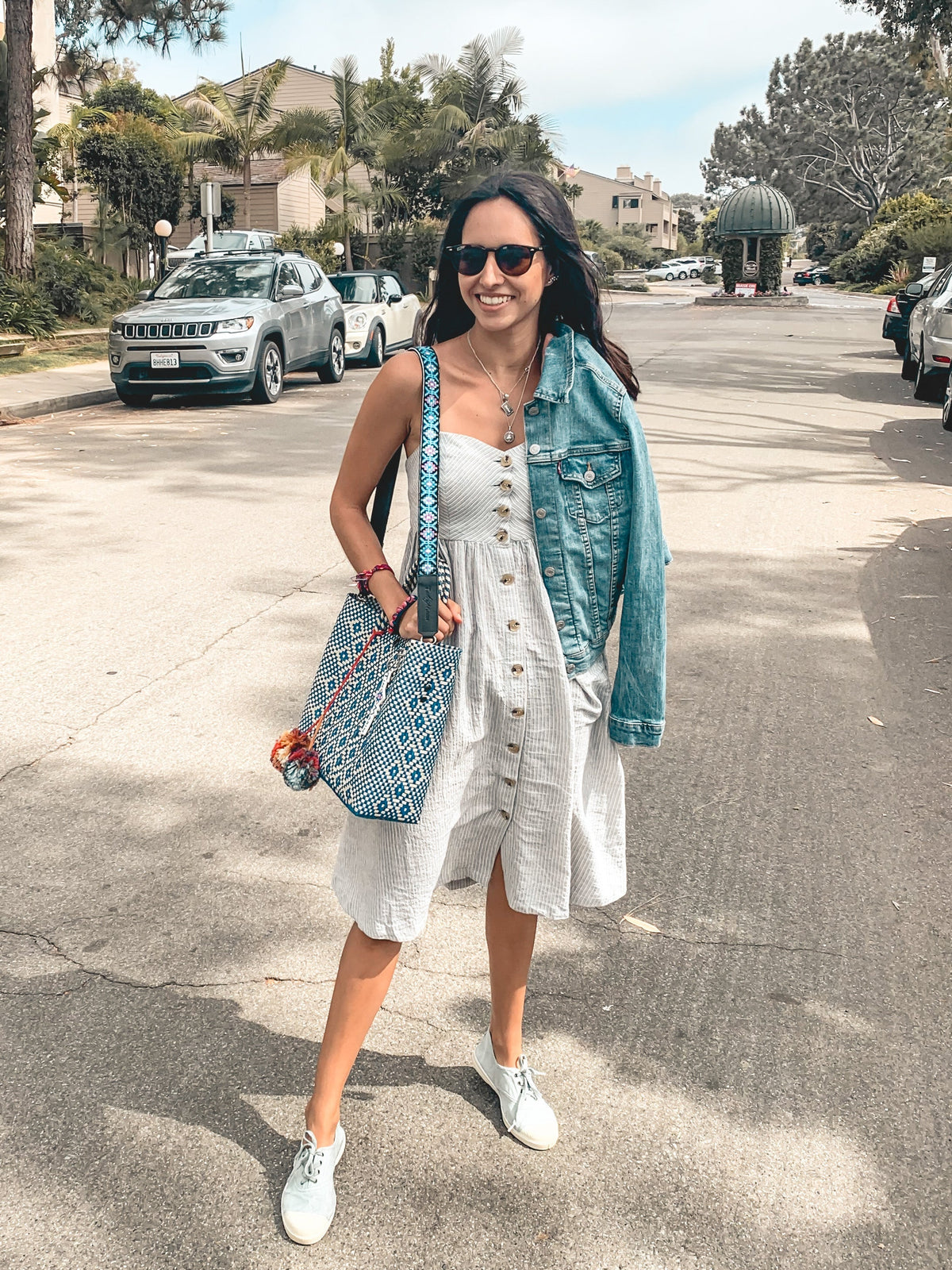 Mai woven bag strap with blue/pink pattern across a light blue crossbody bag