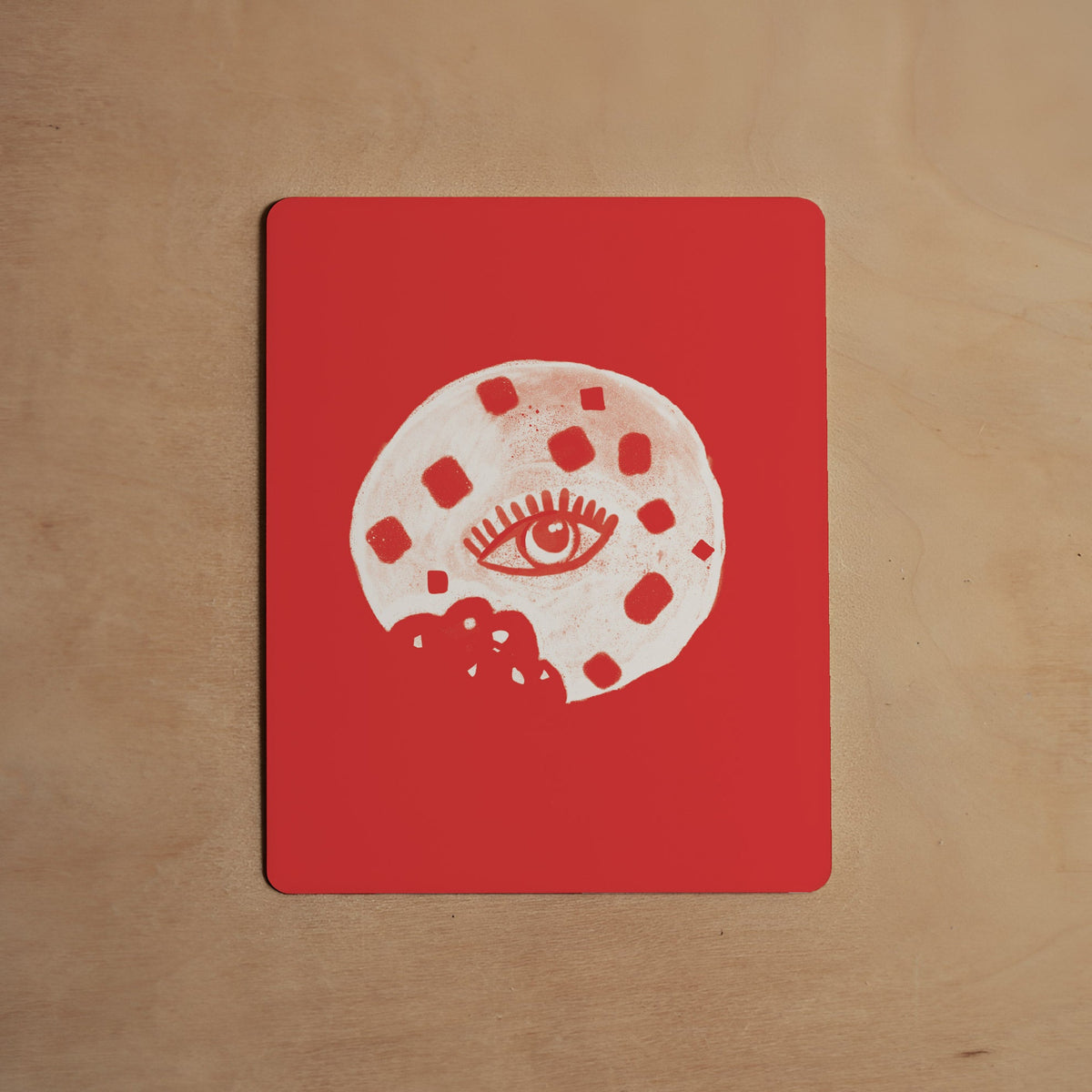 Red trivia card with white symbol circle and black border