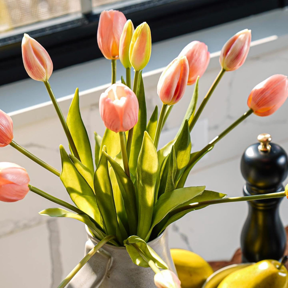 Close-up orange-pink tulip bouquet with green stems and tulip heads