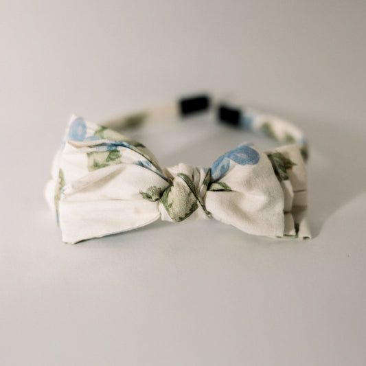 Three-bow headband in cream with cornflower blue polka-dot bow and greenery