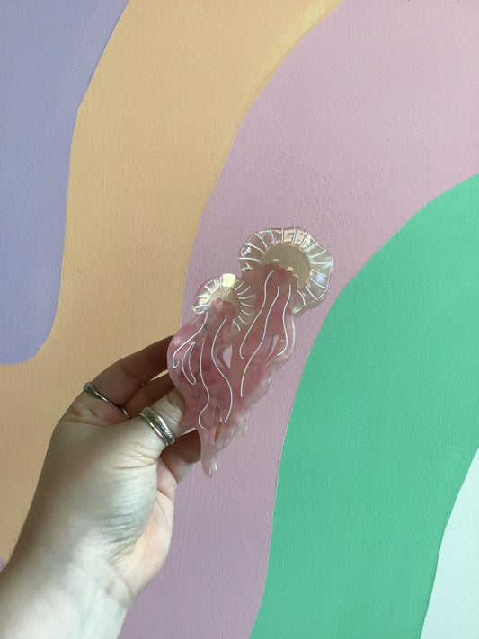 Iridescent jellyfish hair claw with ruffled tentacles, pastel pink tones
