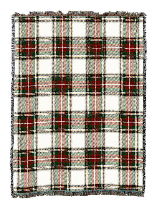 Plaid blanket with cream base and red green tartan stripes, fringed edges
