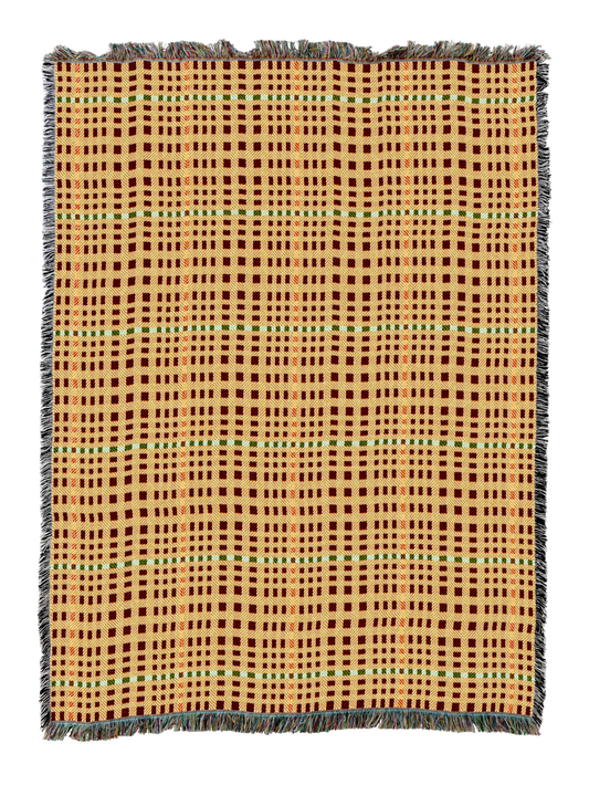 Herringbone-pattern woven blanket in tan and orange grid with blue accents, fringed border