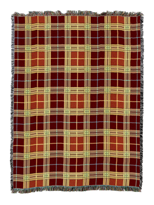 Plaid blanket with red, green, and yellow check pattern and fringed edges