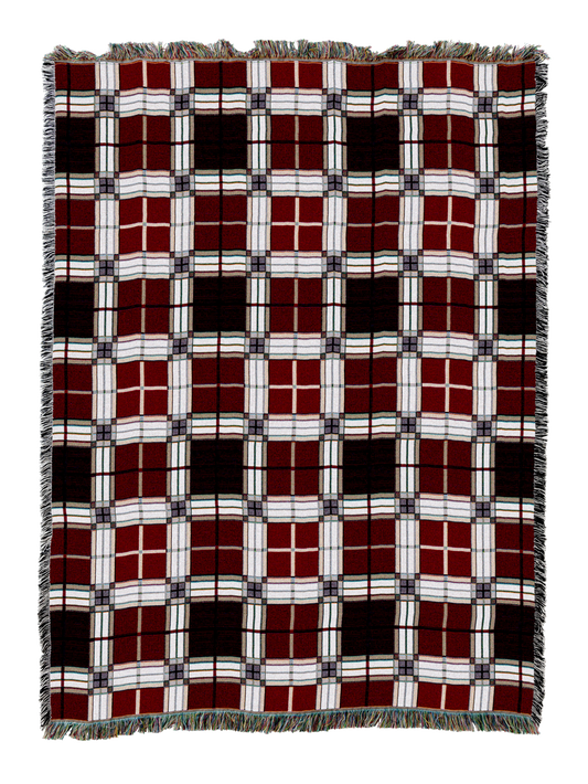 Plaid blanket with red, white, and dark brown grid pattern and fringed edges