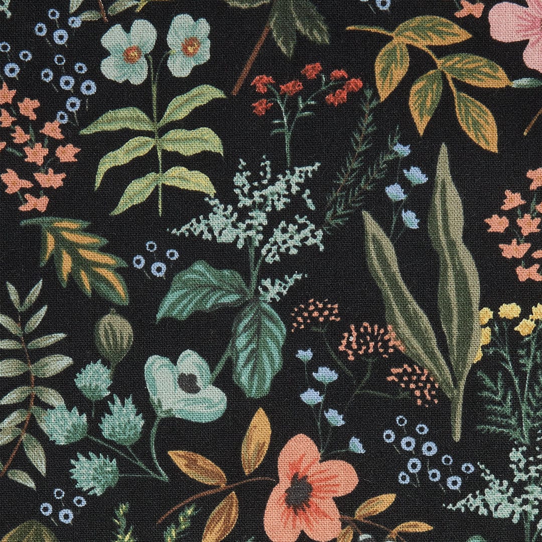 Black fabric with multicolor floral and leaf pattern