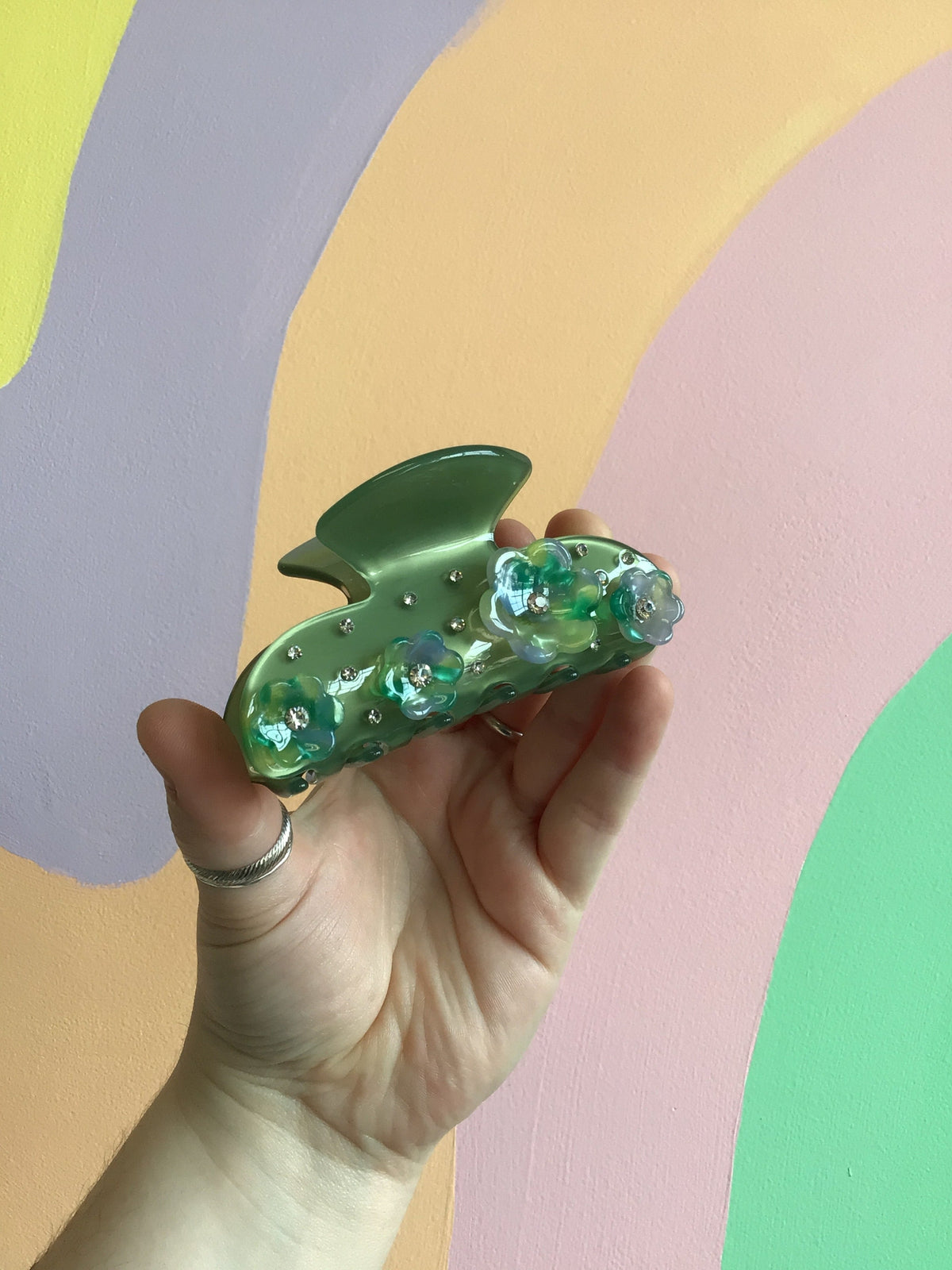 Green flower hair claw clip with appliqué floral details