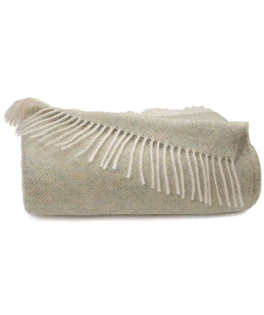 Shetland lambswool herringbone throw in meadow green with off-white fringe ends