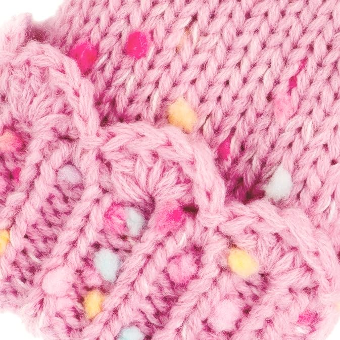 Close-up of pink knit mitten cuff with colorful speckled yarn