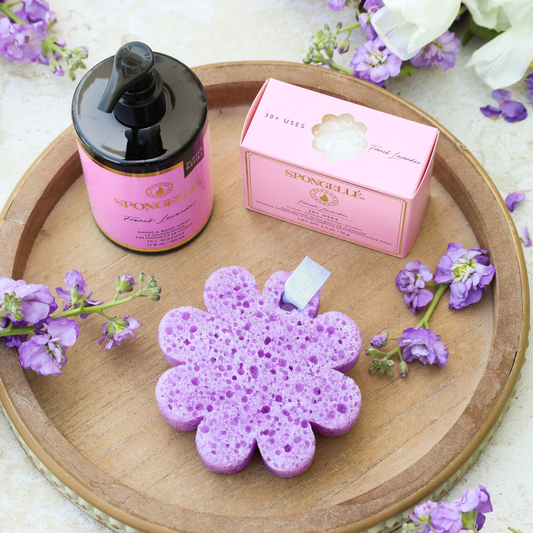 Lavender hand and body wash refill bottle, box, and flower pedi buffer on tray