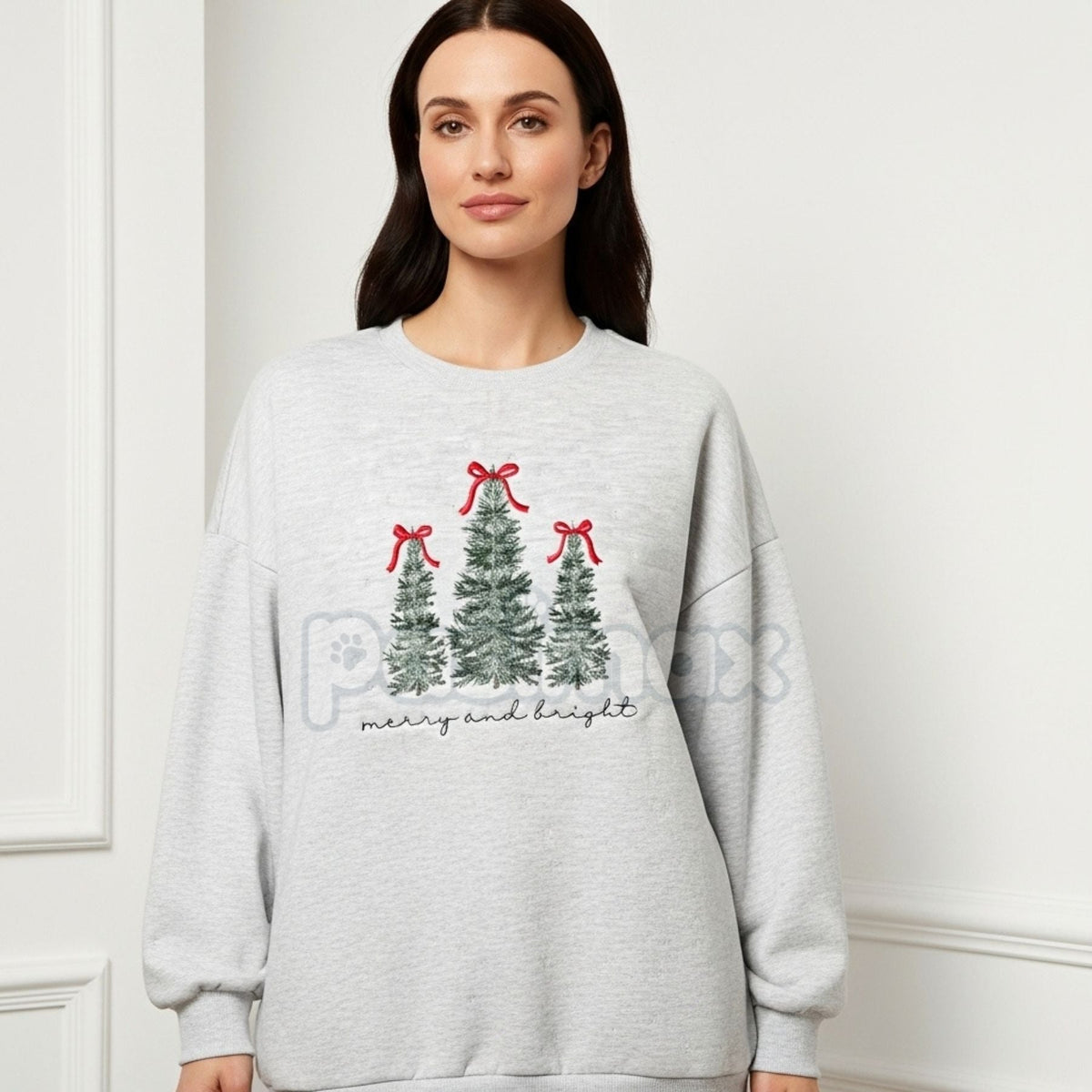 Sport grey crewneck sweatshirt on model with embroidered Christmas trees and red bow ornaments