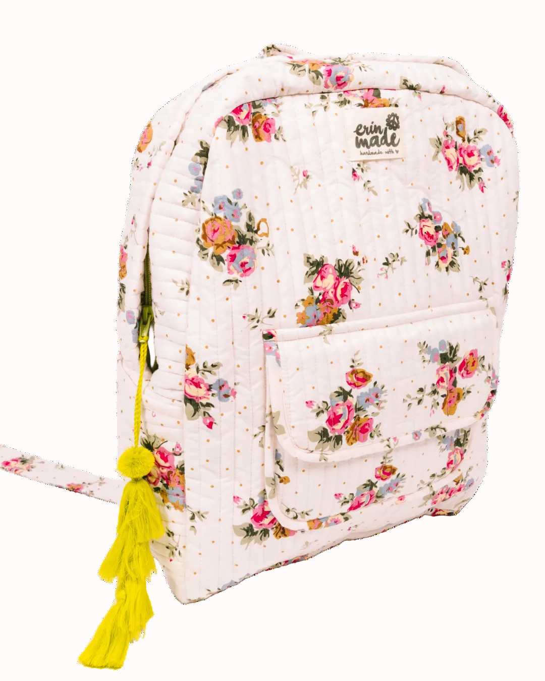 Quilted light pink floral backpack with front pockets and yellow tassel keychain