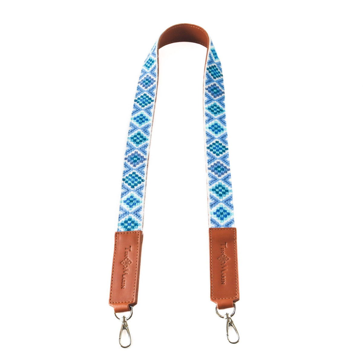 Woven bag strap set with blue geometric pattern and tan leather end tabs, with metal hooks