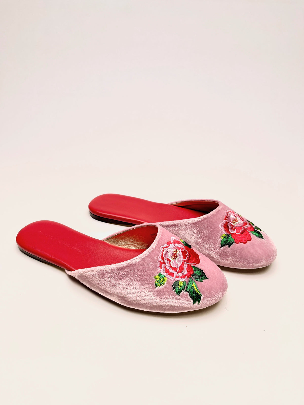 Lavender pink velvet mules with peony floral embroidery and matching red slide soles