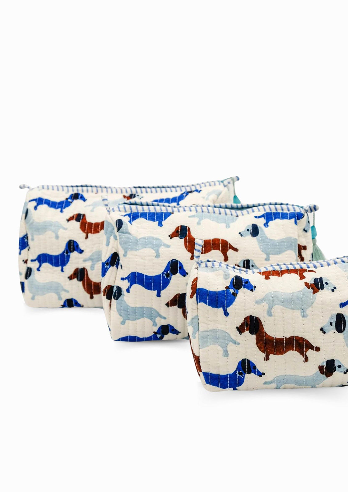 Dog-print toiletry pouches, three sizes with zipper tops and tassel trim