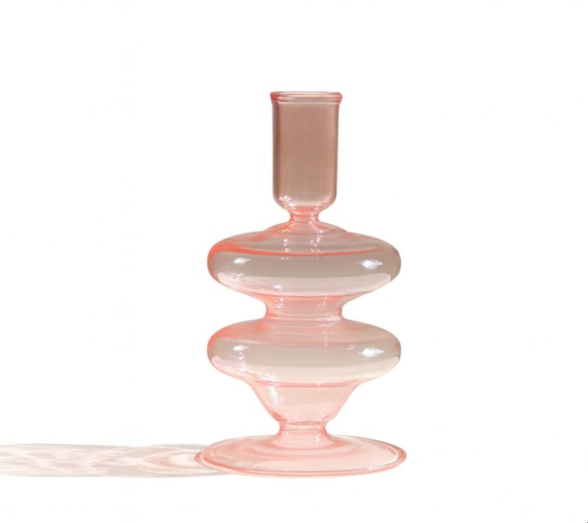 Siri pink glass candle holder with rounded pedestal base and vertical cylindrical cup