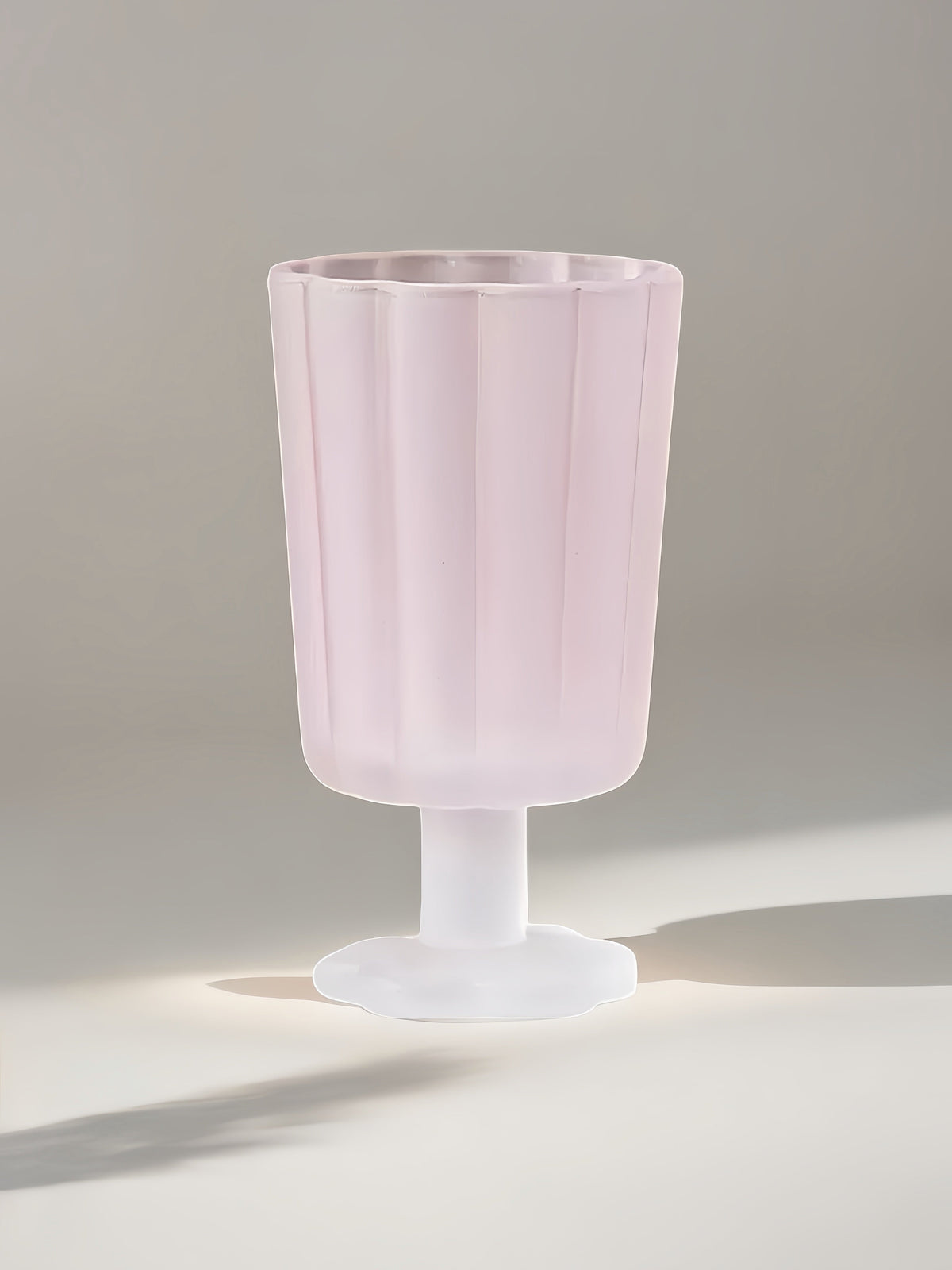 Pink petal goblet with flared rim and white pedestal stem base