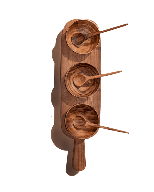 Carved wooden condiment serving set with three round bowls and spoon handles