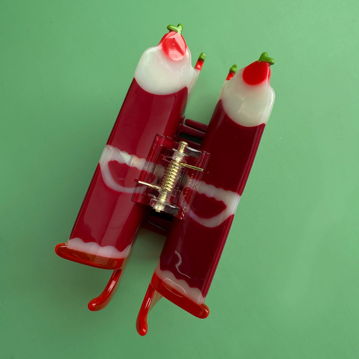 Cake hair claw back view with metal spring clip and red cherry candle details