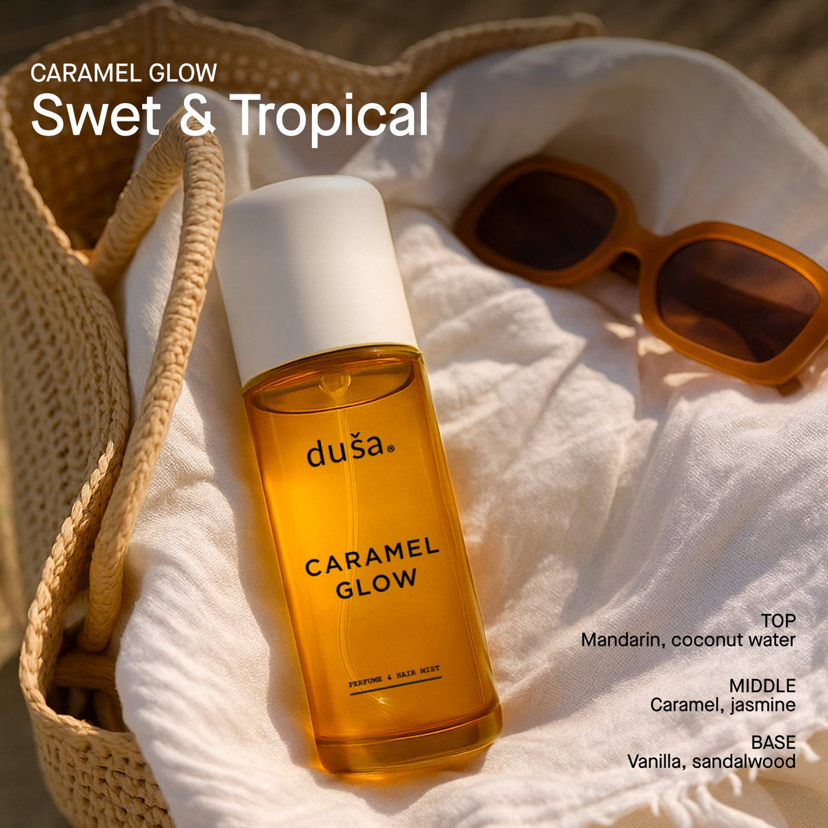 Caramel Glow perfume mist bottle with white cap, amber glass on soft towel