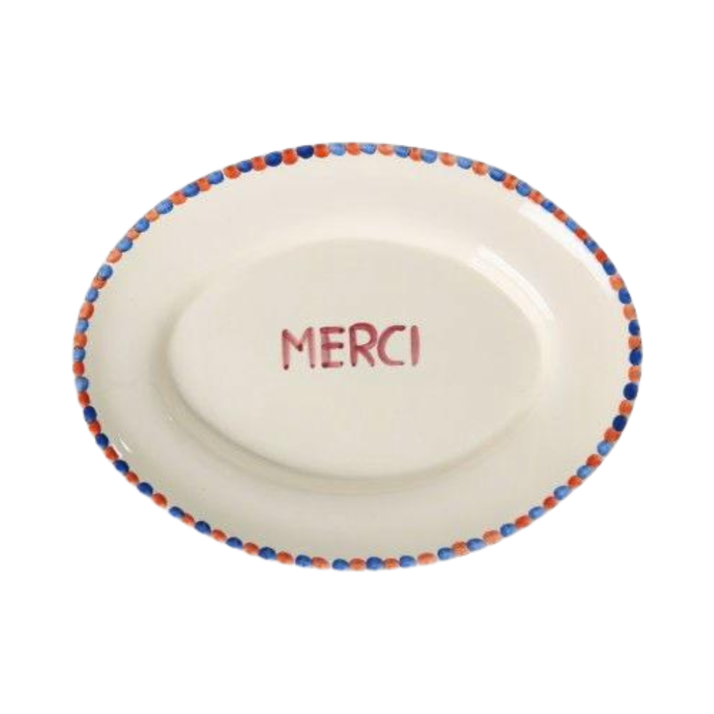 Ceramic serving platter with hand-painted MERCI and blue dot border rim, white base