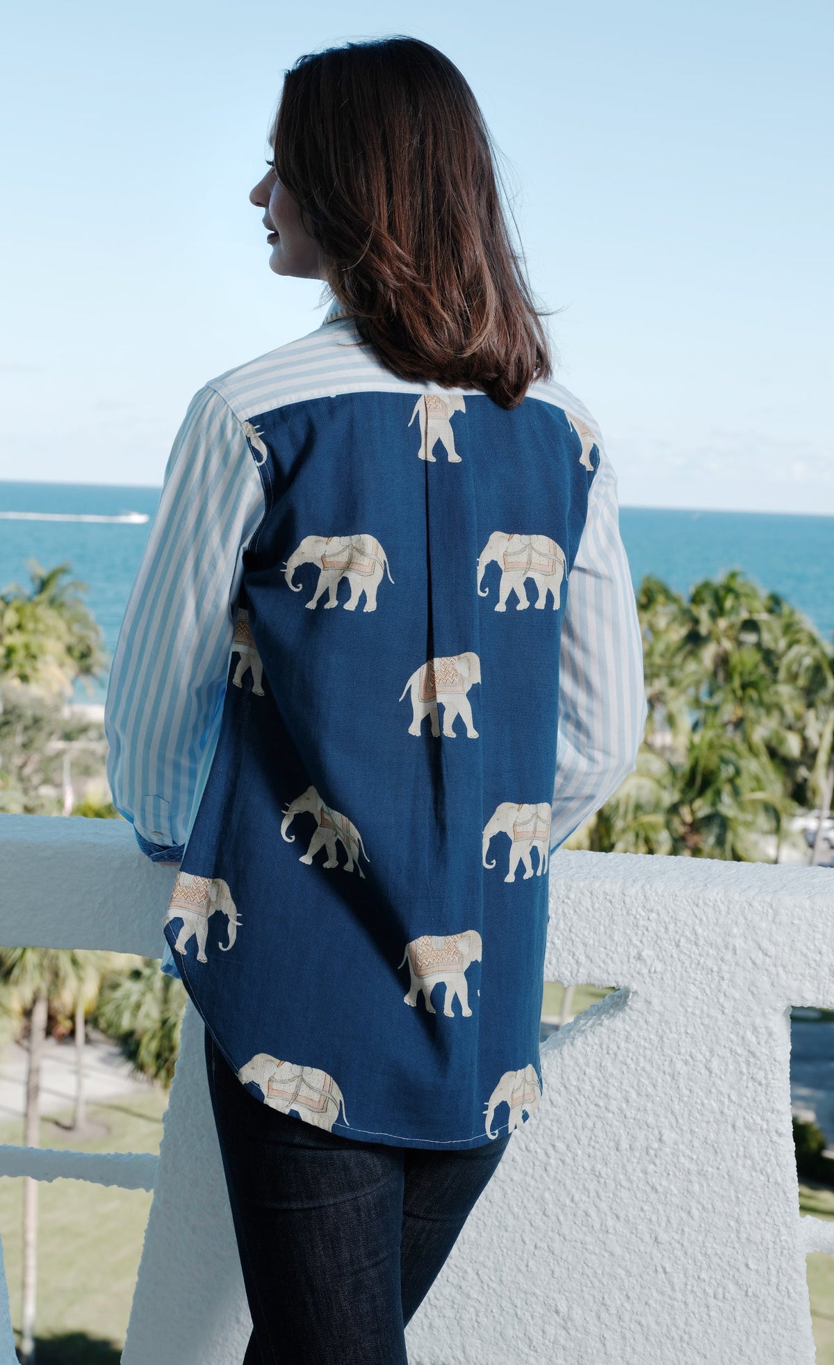 Women's hi-lo top, navy back with light elephant print and vertical striped sleeves