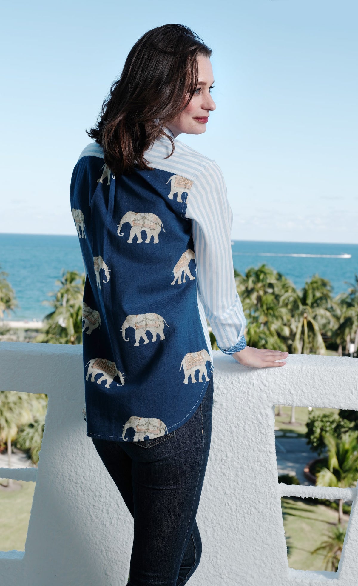 Women's hi-lo top with navy back panel and elephant print, striped sleeves