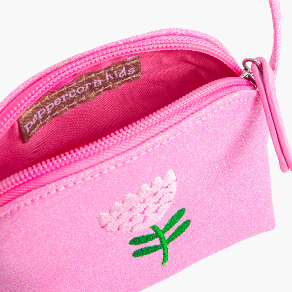 Open pink glitter purse showing zippered compartments and flower embroidery